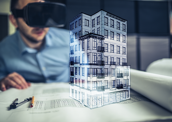 Man looking at a building drawing through AR Goggles 