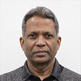 Profile shot of Krishnan Kannoorpatti in a grey collared t-shirt